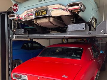 Car Lifts in Denver with Blue and Red Classic Cars on Them