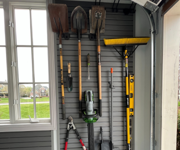 Store Wall Tools Hanging on Custom Optimus Garage Installed Slatwalls